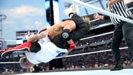 AJ hits a 'Styles Clash' on Shane McMahon